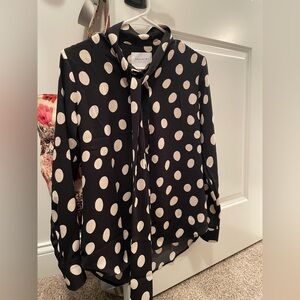 The Shirt by Rochelle Behrens tie neck polka dot blouse.